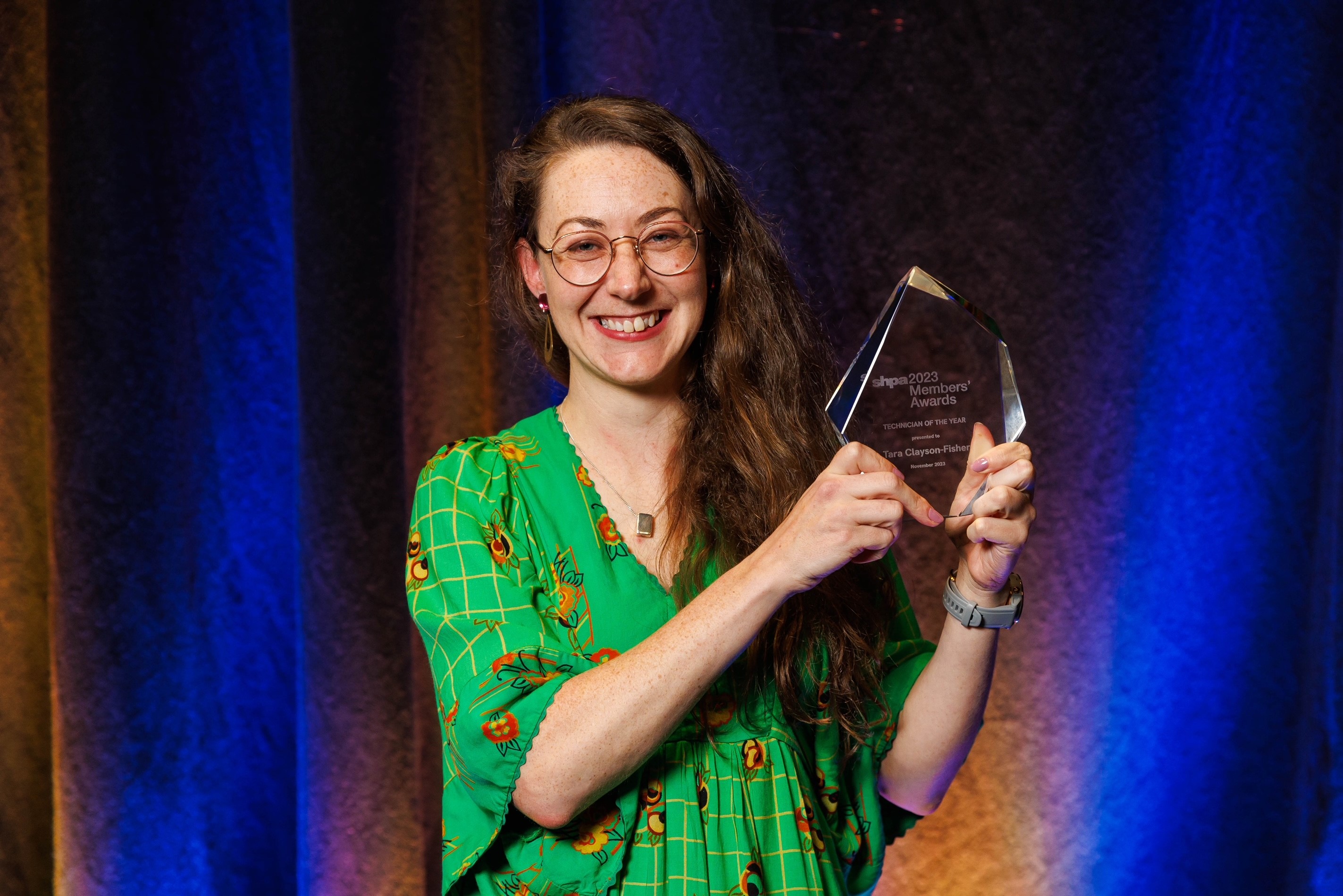Tara Clayson-Fisher with award