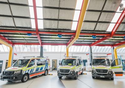 A group of ambulance cars waiting for repair.