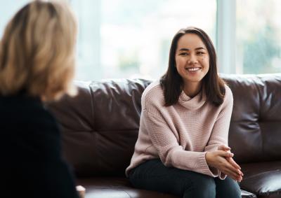 A woman speaking with a psychologist.